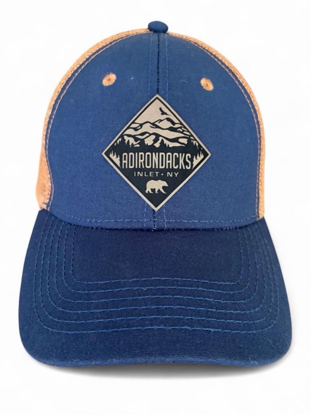 Adirondacks- Inlet, NY adult size snapback trucker hat in navy blue and tan.
